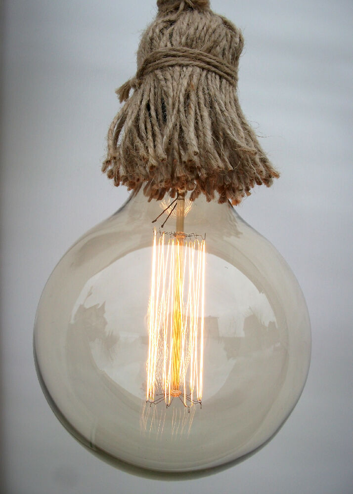 Wall light made from a rope and natural wood