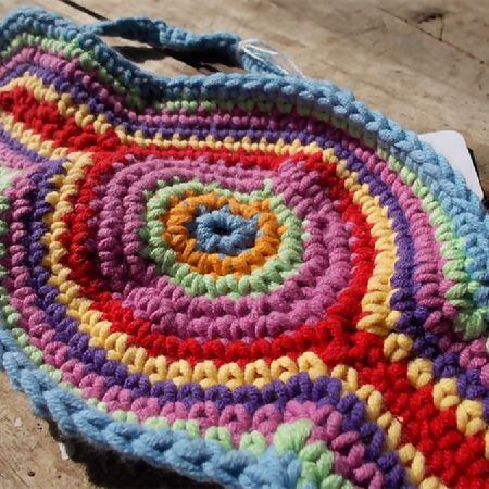 Crocheted headband in rainbow colours