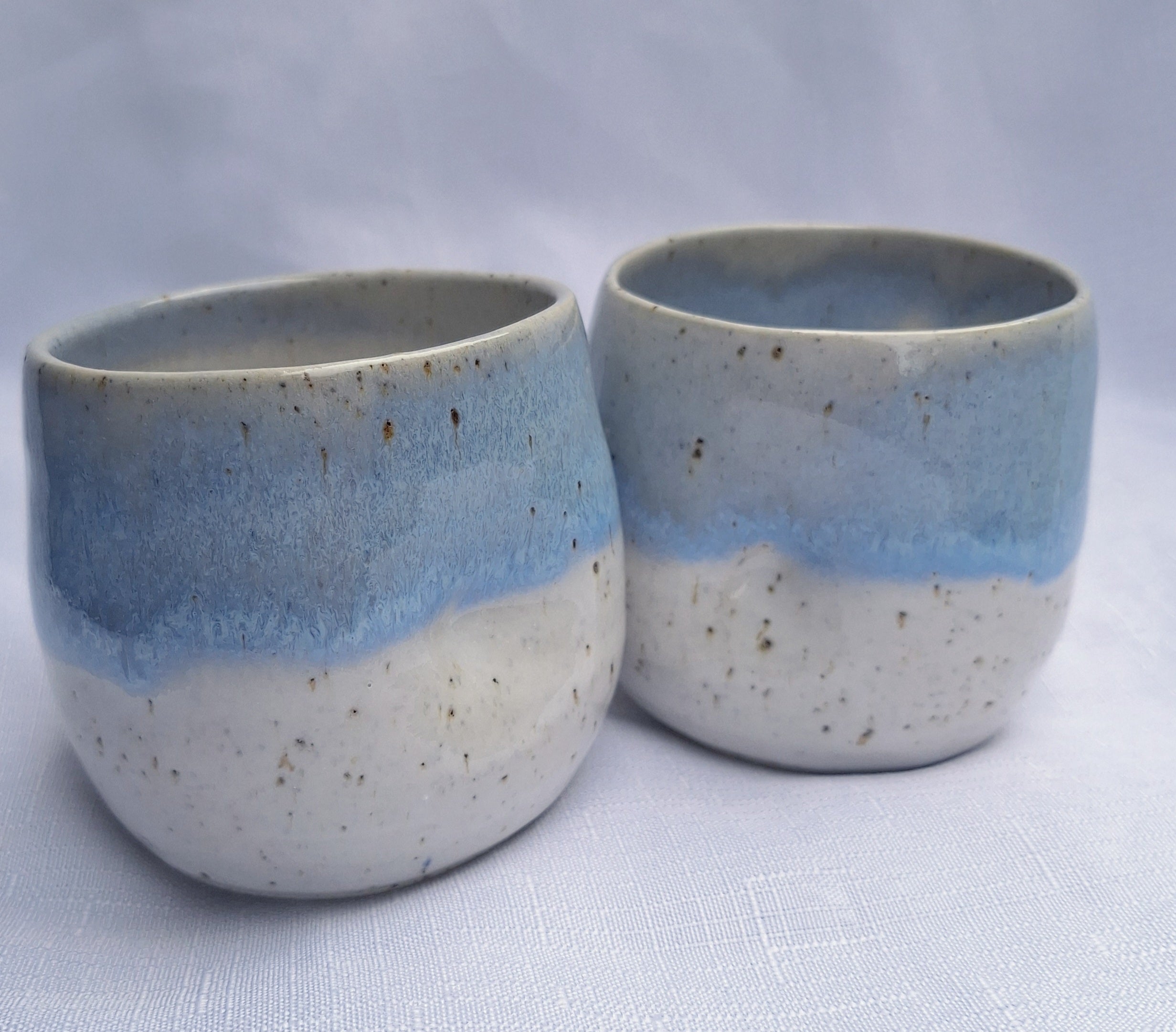 Blue and white speckled ceramic dimple mugs