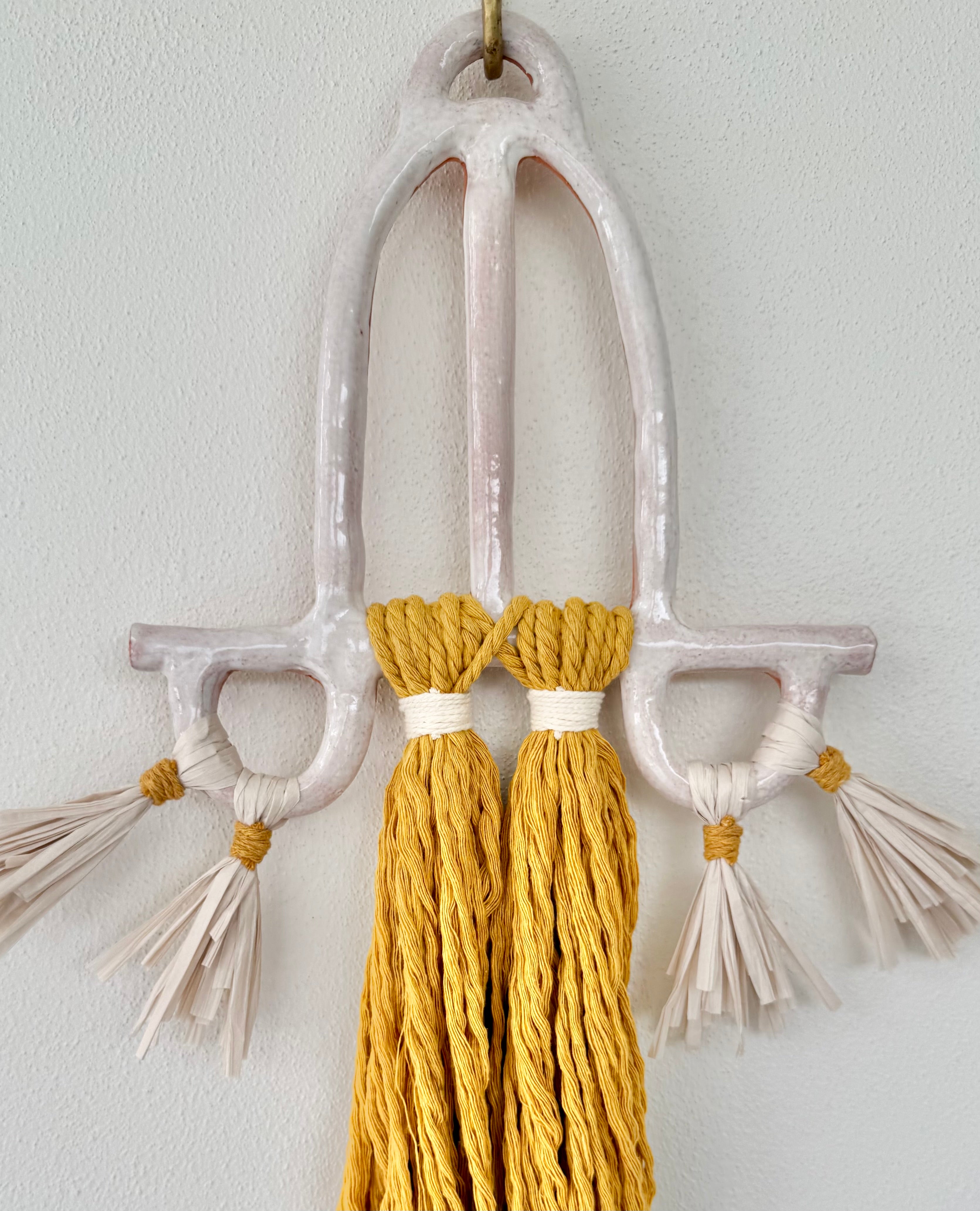 Clay and cord wall hanging