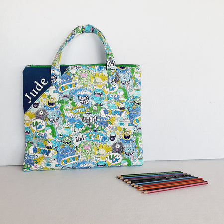 Personalized friendly monsters inspired library and laptop bag with glow-in-the-dark name