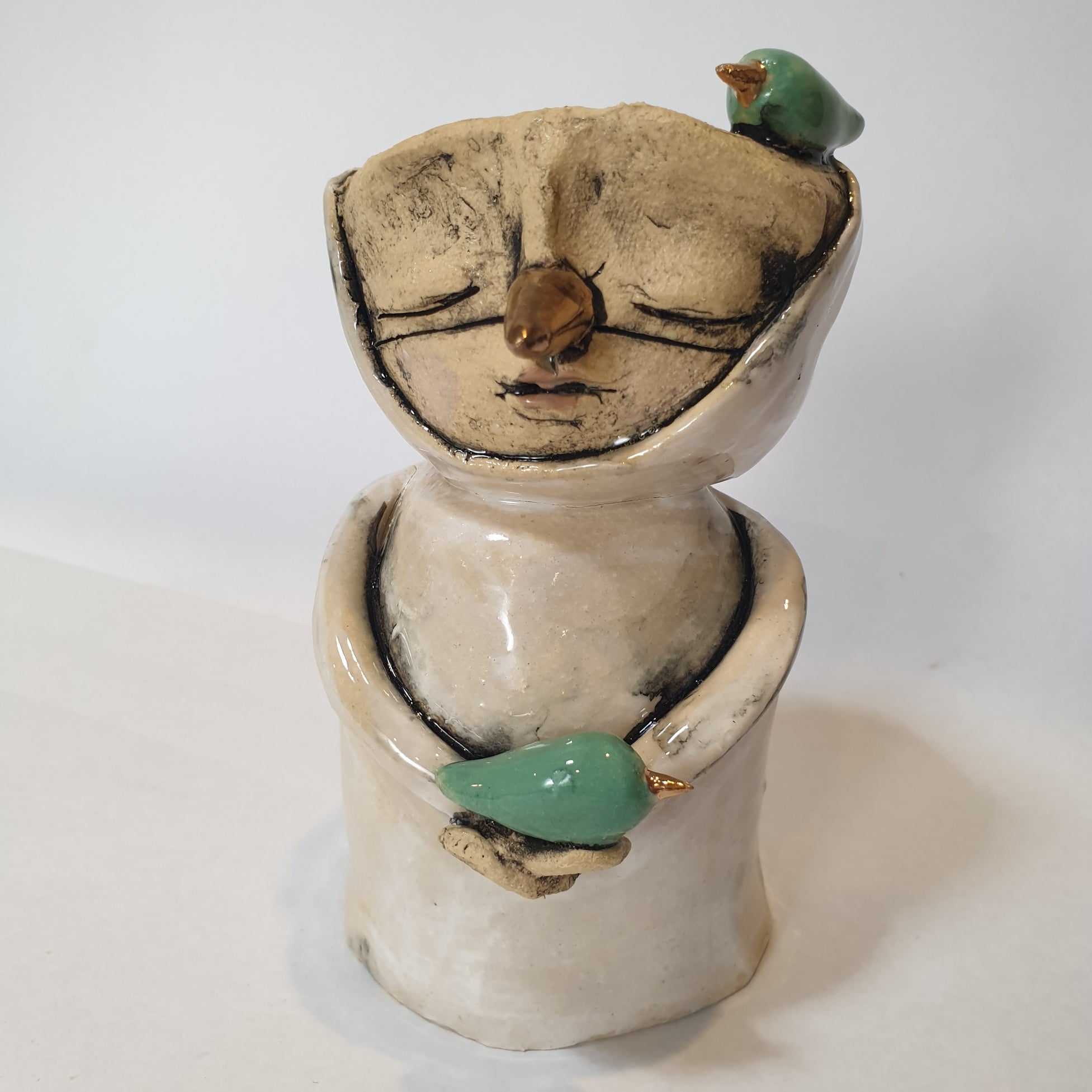 medium clay person, candle, bird