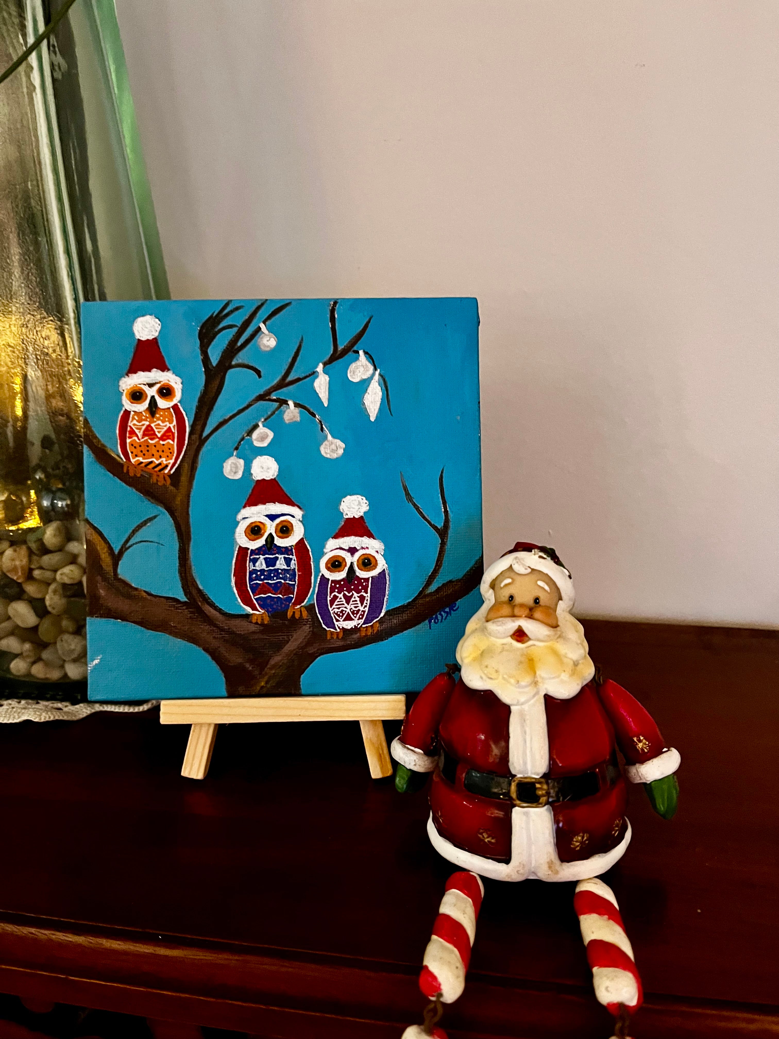 Owls in christmas hats