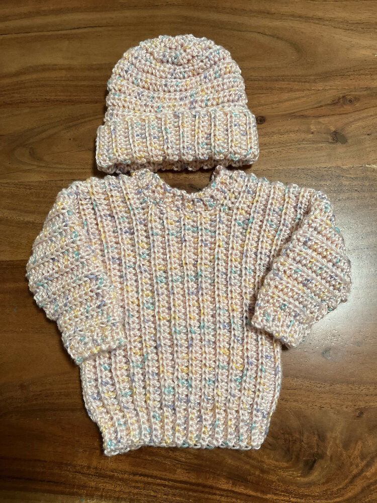 Hand crocheted baby’s jumper and matching beanie