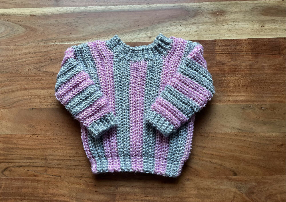 Hand crocheted baby’s jumper pink and grey