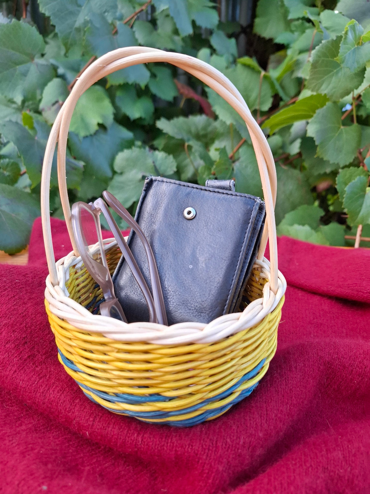 Small blue yellow handled basket
