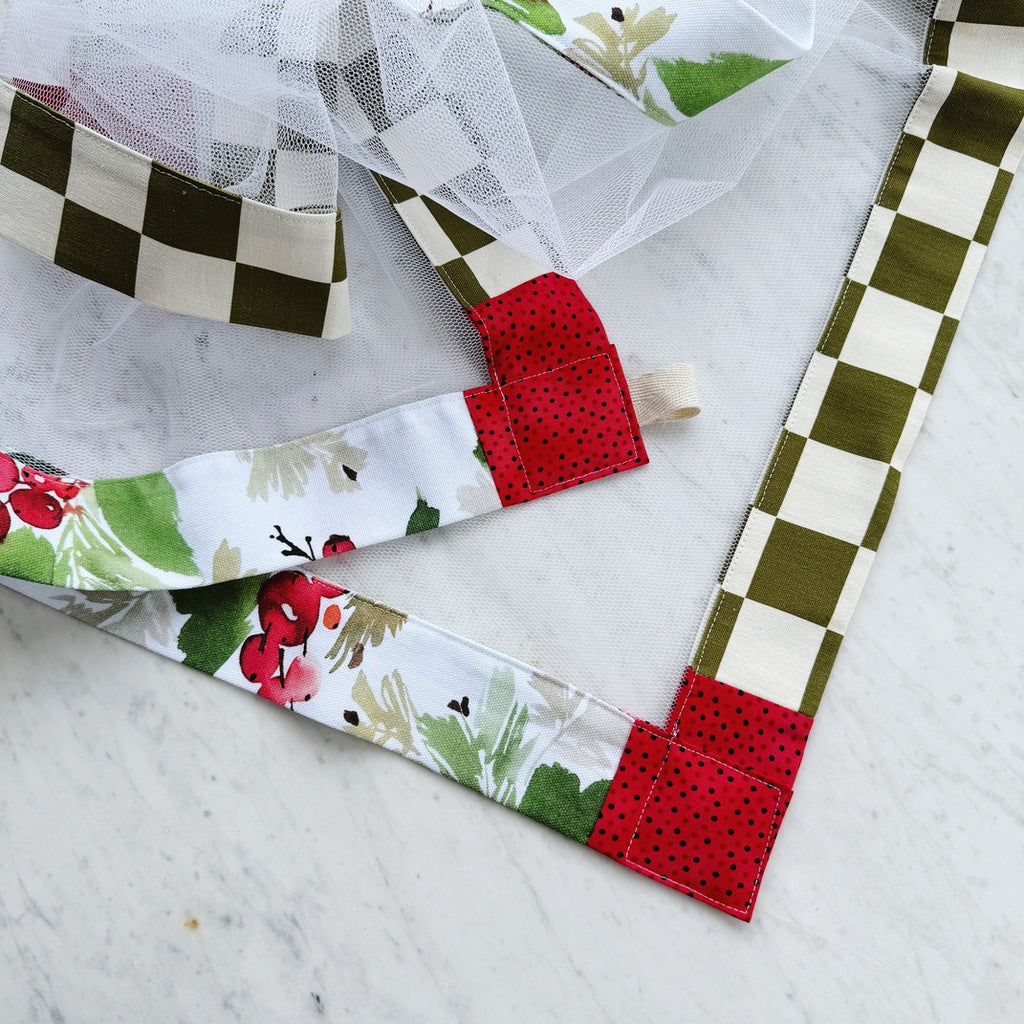 Green and red weighted mesh food cover. Charcuterie board net throw. Cheese platter fly cover. Fruit bowl cover.