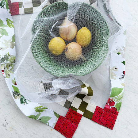 Green and red weighted mesh food cover. Charcuterie board net throw. Cheese platter fly cover. Fruit bowl cover.