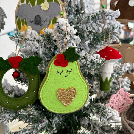Festive avocado ornament with golden heart