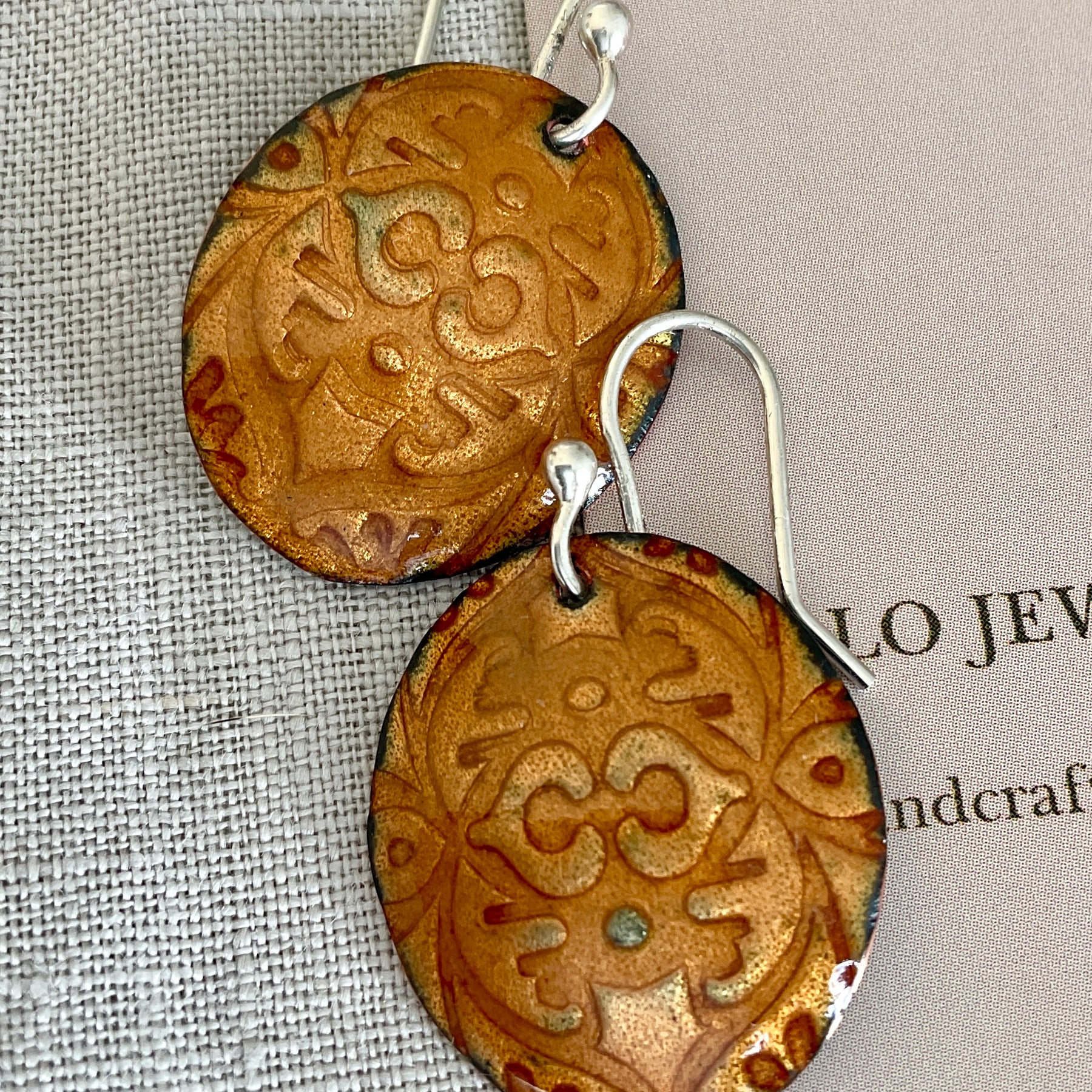 Gold embossed enamel earrings. Handmade