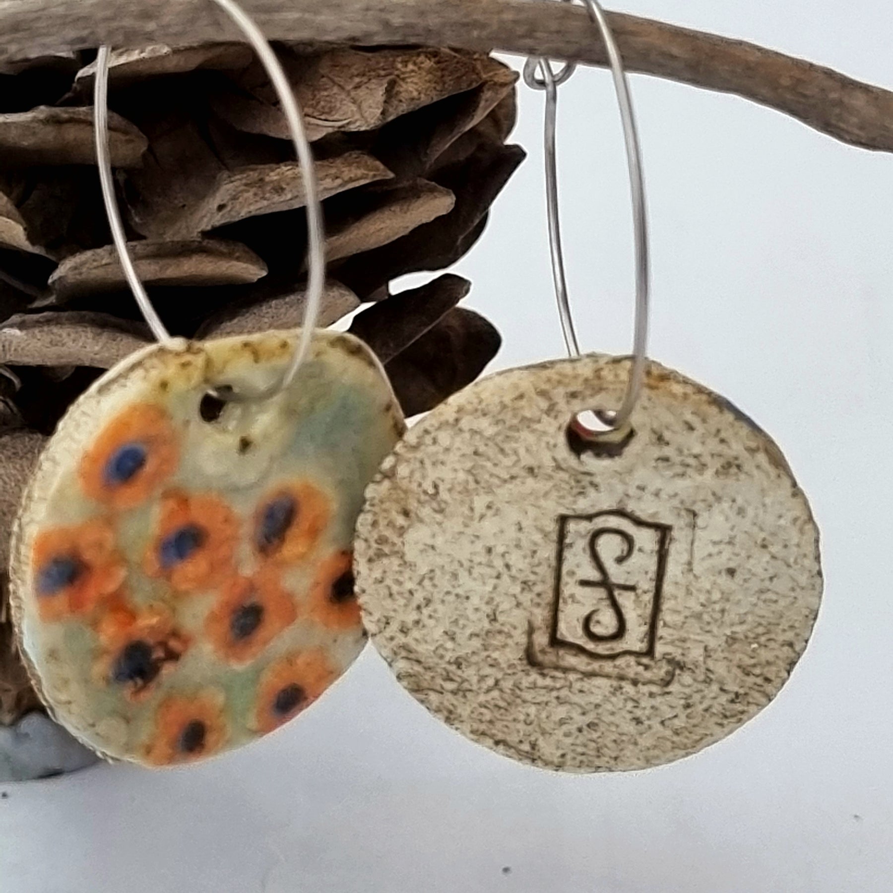 Handmade Stoneware Ceramic Earrings, orange floral multi-coloured, 28mm diameter, pierced ears