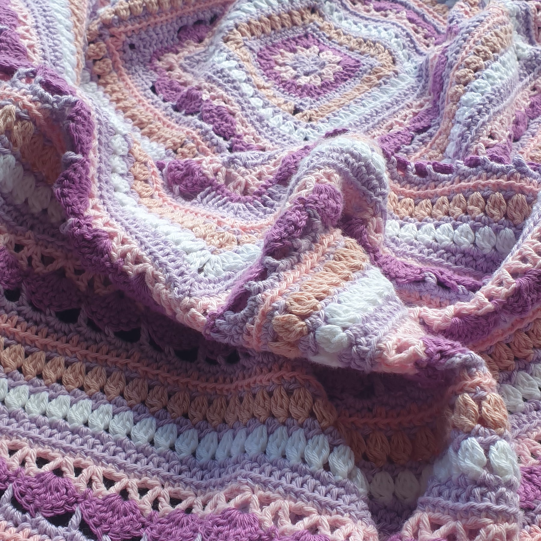 Beautiful crochet cotton afghan in pink/lilacs