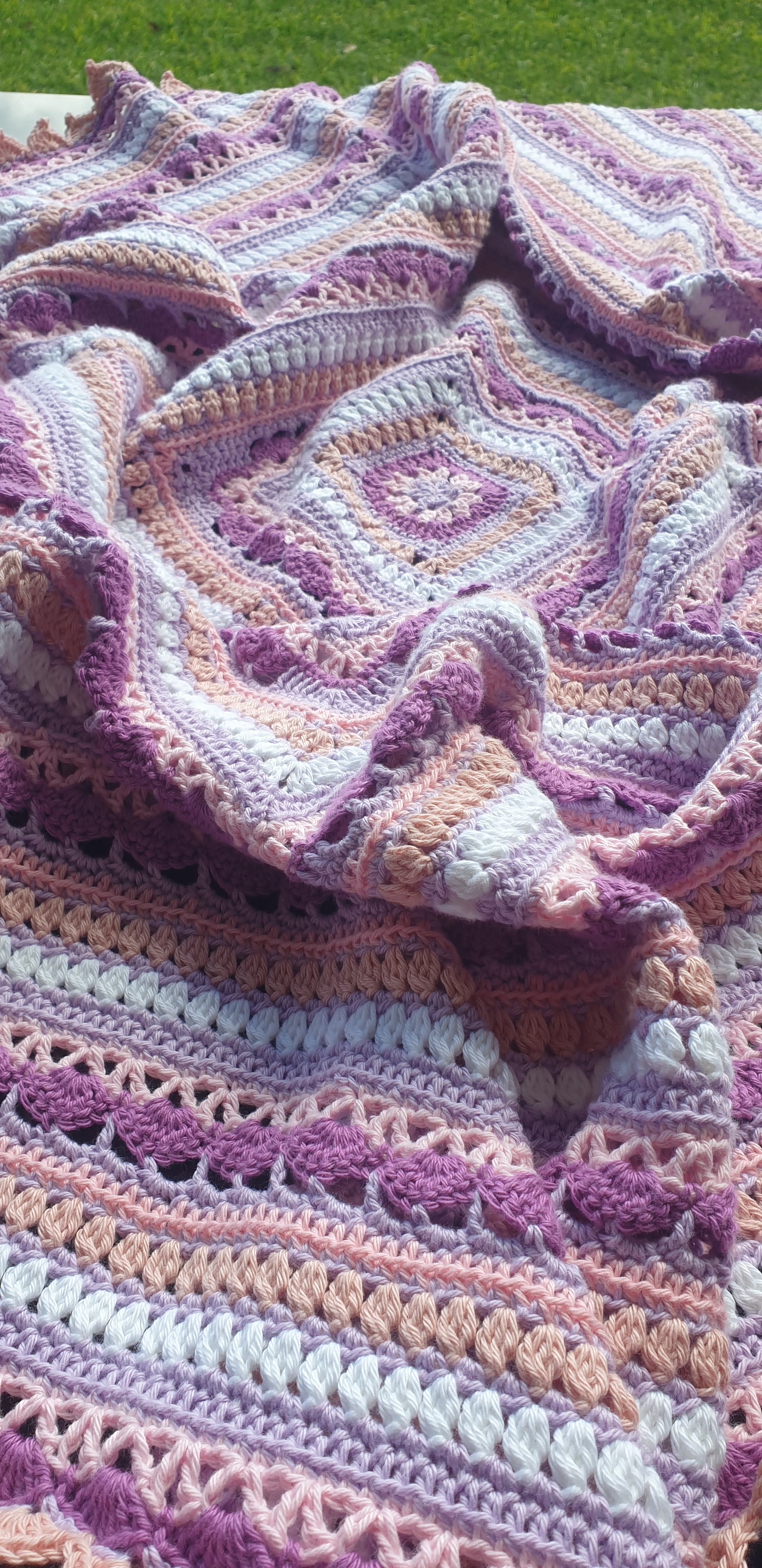 Beautiful crochet cotton afghan in pink/lilacs