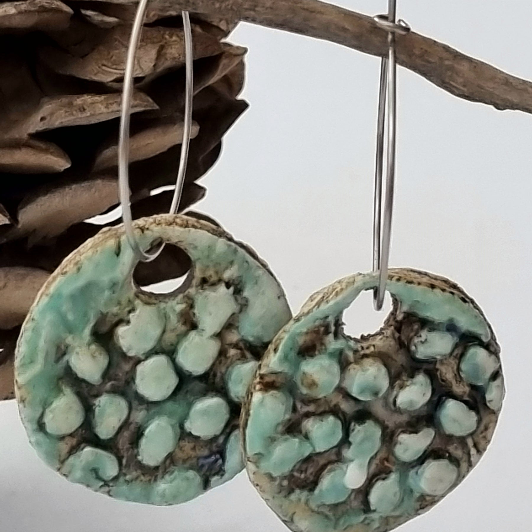 Handmade Stoneware Ceramic Earrings, blue-green black multi-coloured, 28mm diameter, pierced ears