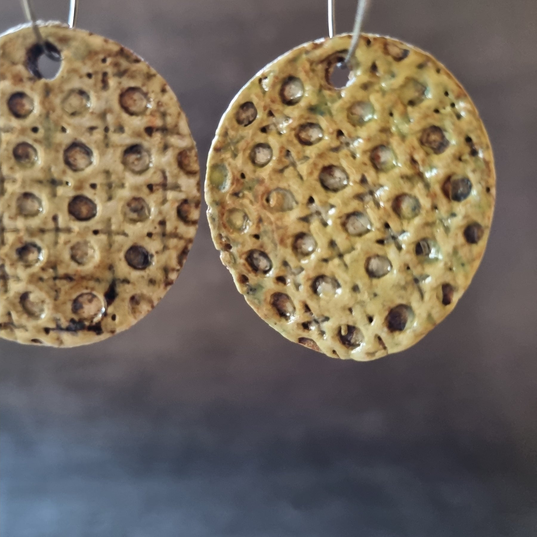 Handmade Stoneware Ceramic Earrings, muted green lattice multi-coloured, 35mm diameter, pierced ears