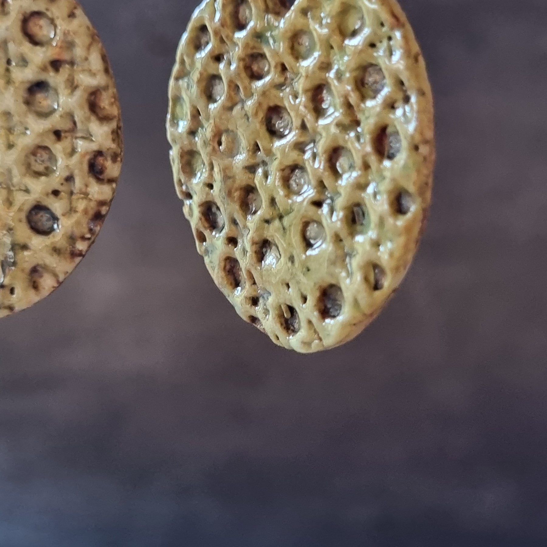 Handmade Stoneware Ceramic Earrings, muted green lattice multi-coloured, 35mm diameter, pierced ears