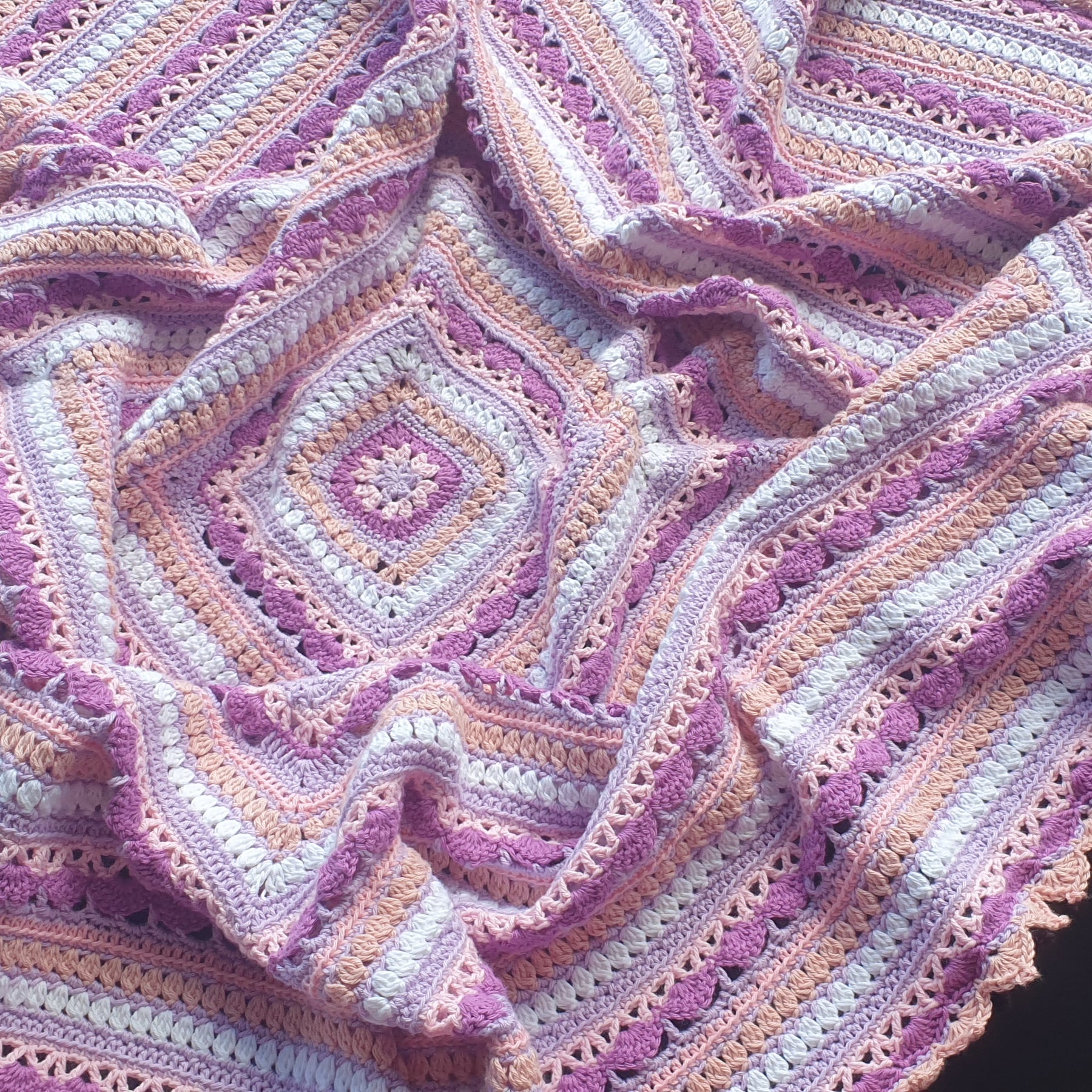 Beautiful crochet cotton afghan in pink/lilacs
