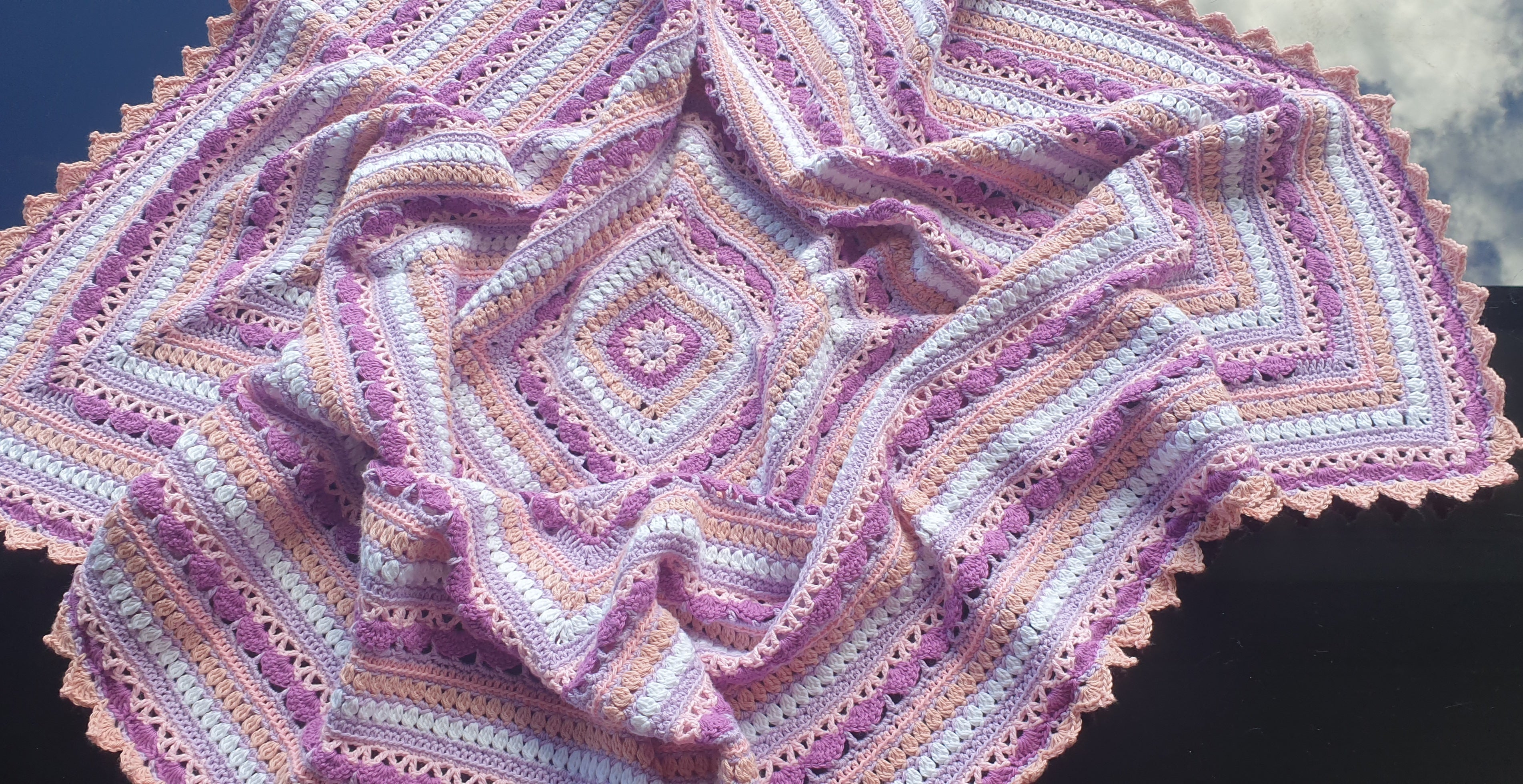 Beautiful crochet cotton afghan in pink/lilacs