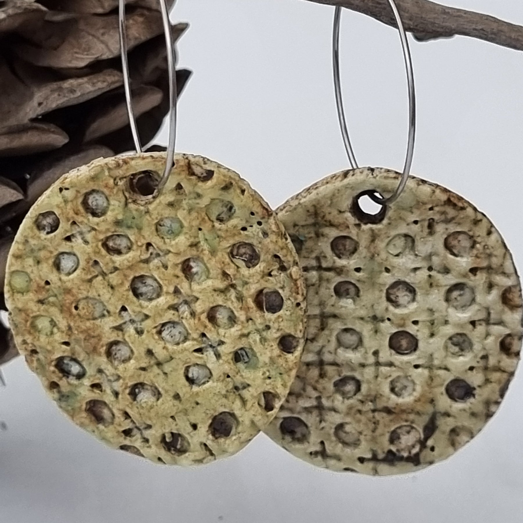 Handmade Stoneware Ceramic Earrings, muted green lattice multi-coloured, 35mm diameter, pierced ears