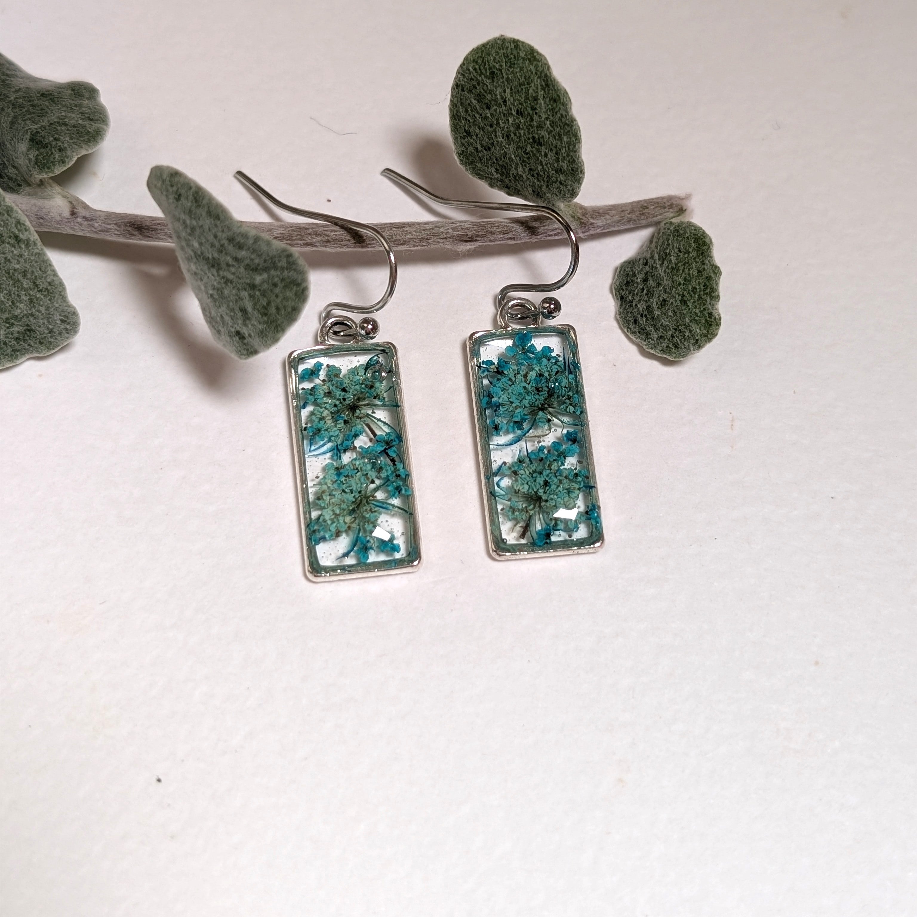 Rectangular silver earrings with teal Queen Anne's Lace