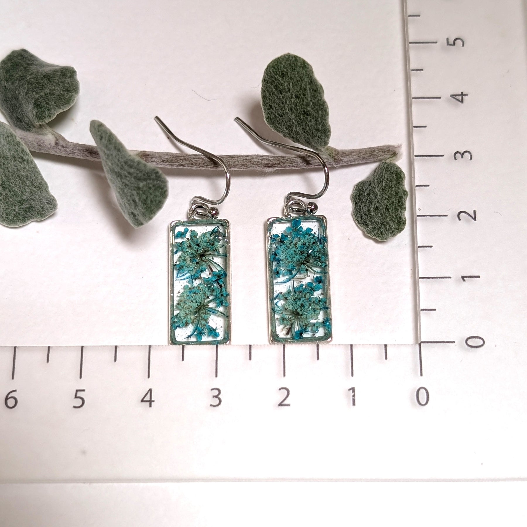 Rectangular silver earrings with teal Queen Anne's Lace