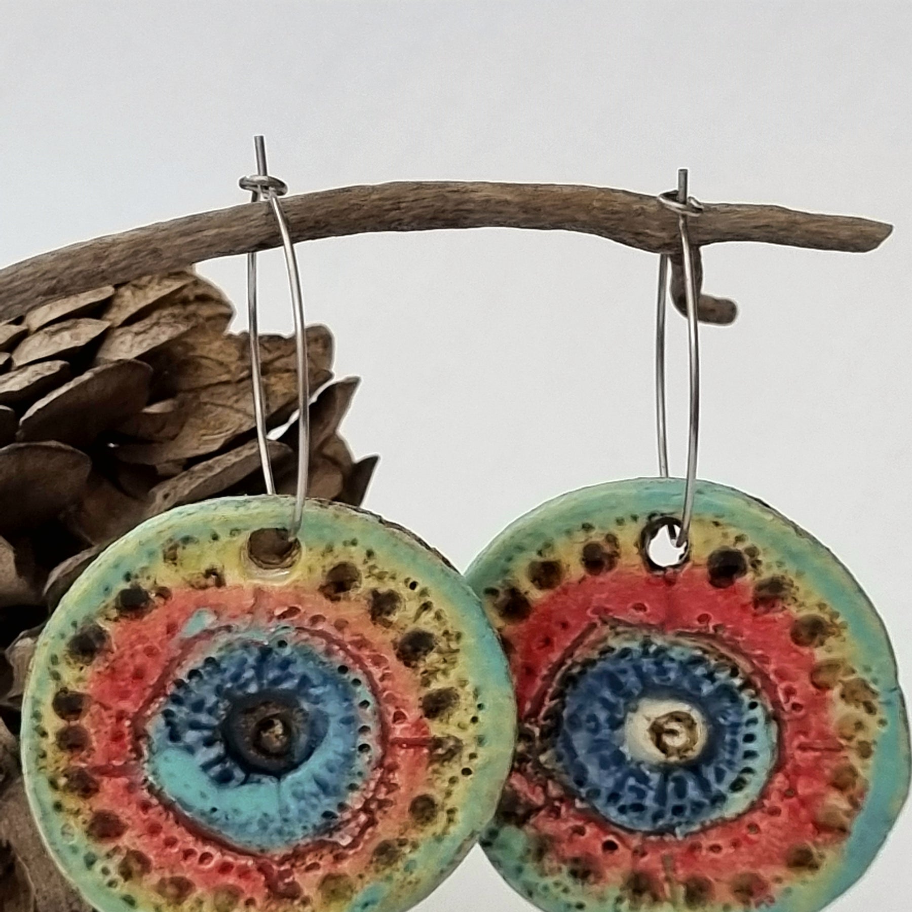 Handmade Stoneware Ceramic Earrings, blue-orange-green multi-coloured, 35mm diameter, pierced ears