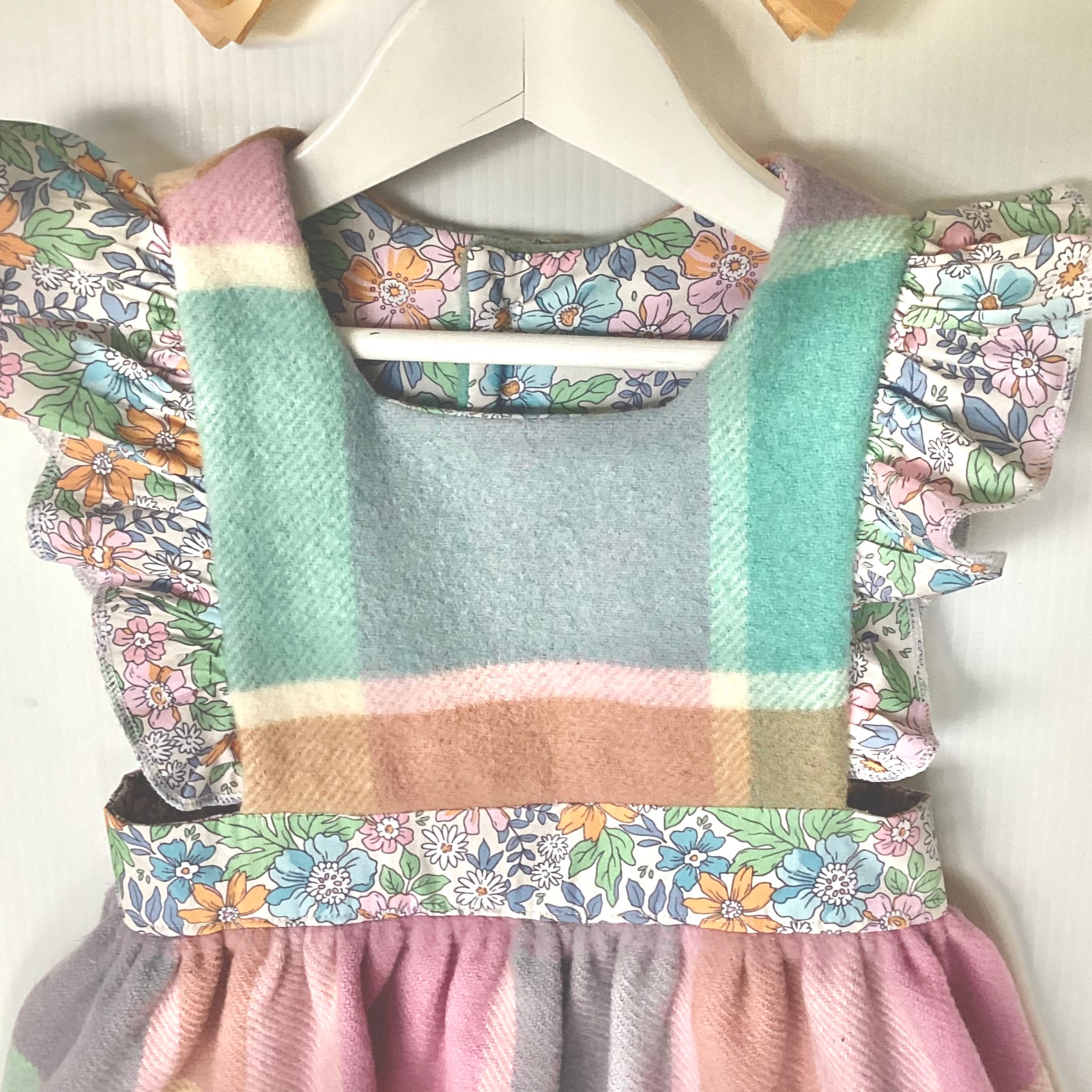 Girl's Upcycled Blanket Pinafore with Sleeve Ruffles and Hand Embroidery