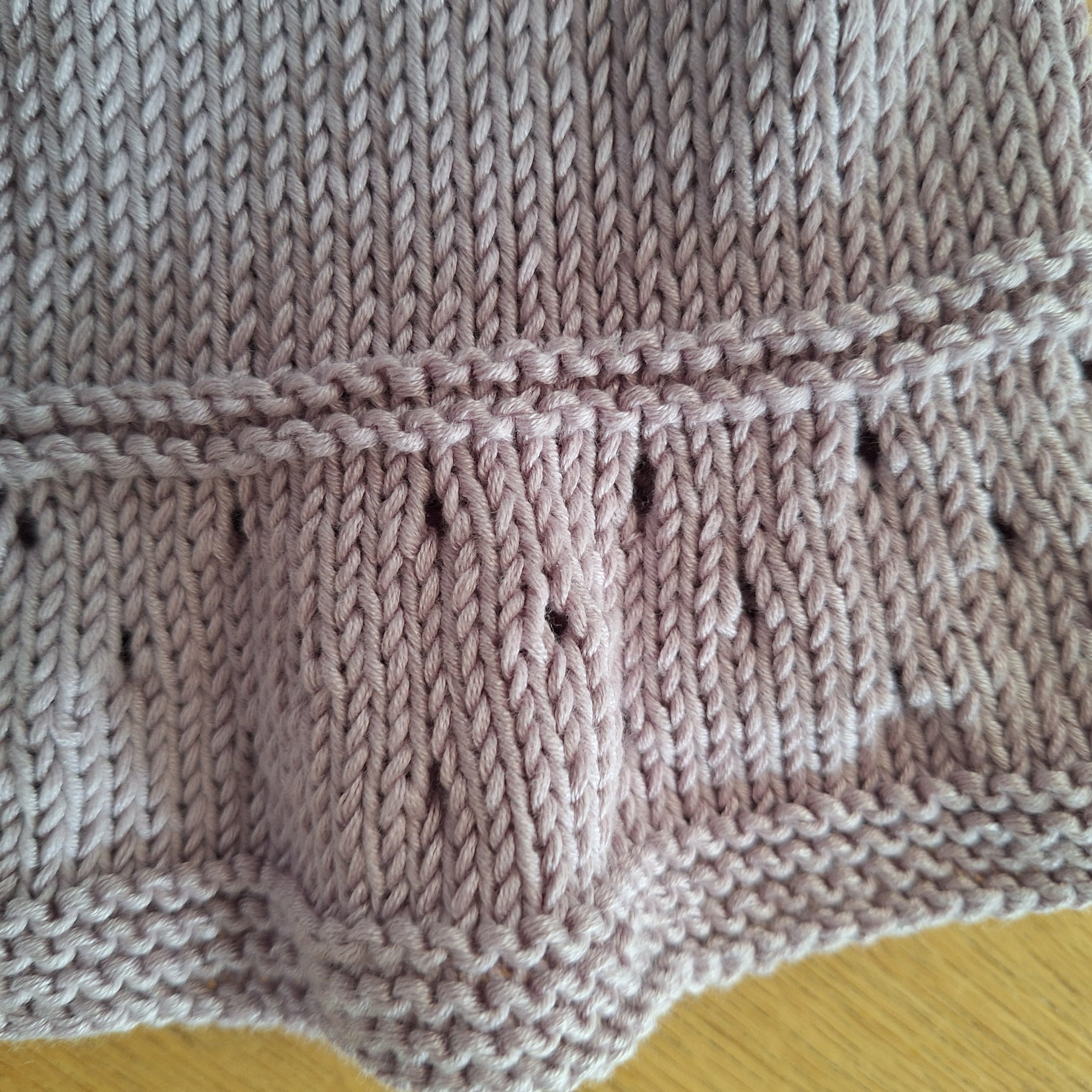 Handknitted Baby Cardigan in 100% natural Lilac yarn