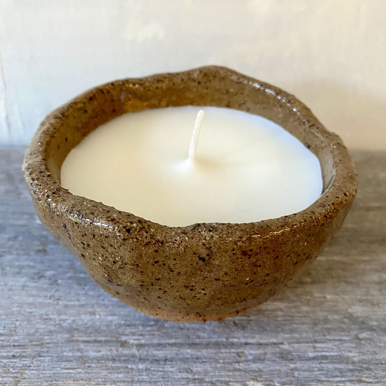 Soy candle in rustic clear glazed speckled ceramic bowl