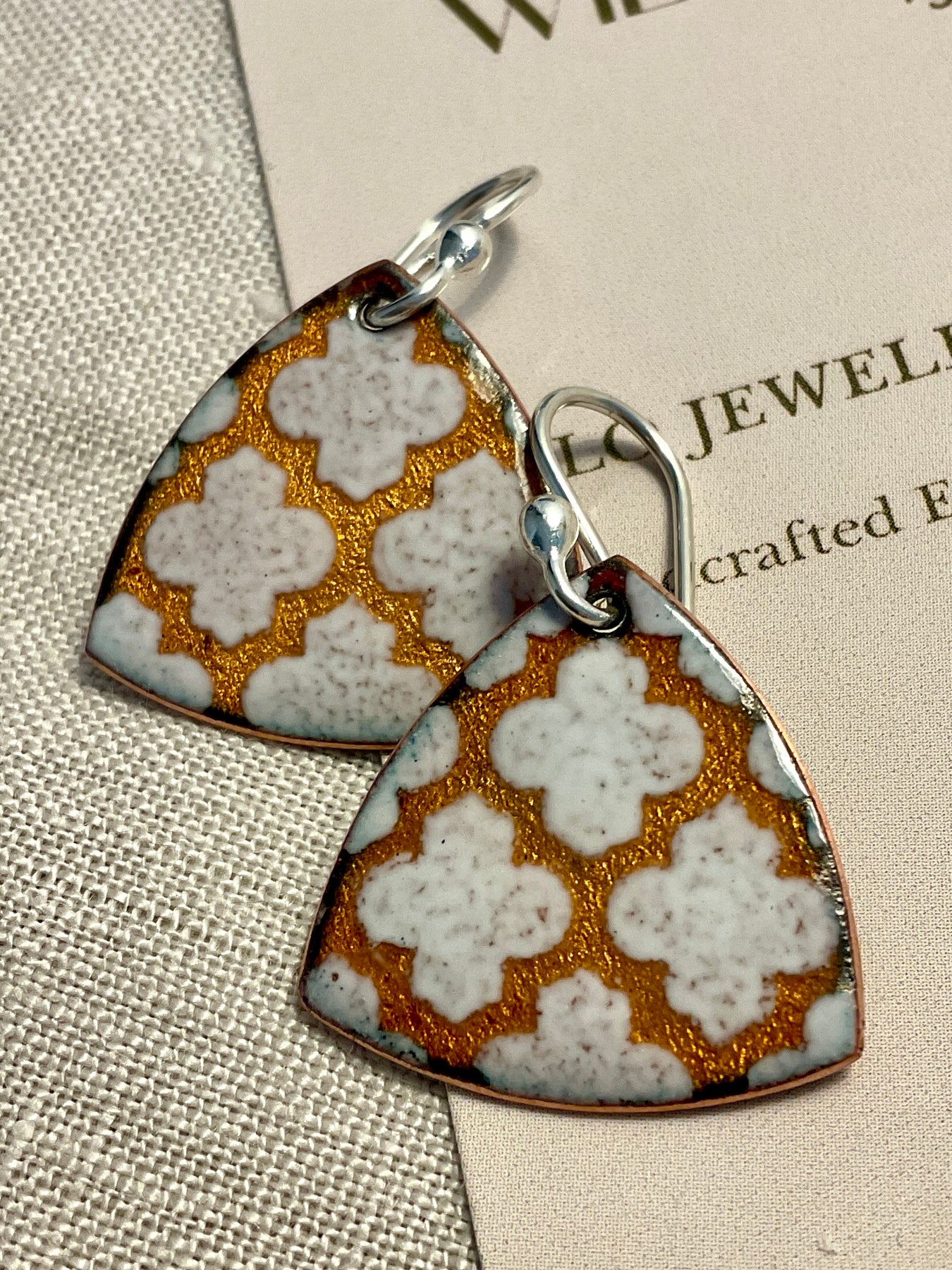 Golden and white pattern earrings. Enamel. Handmade