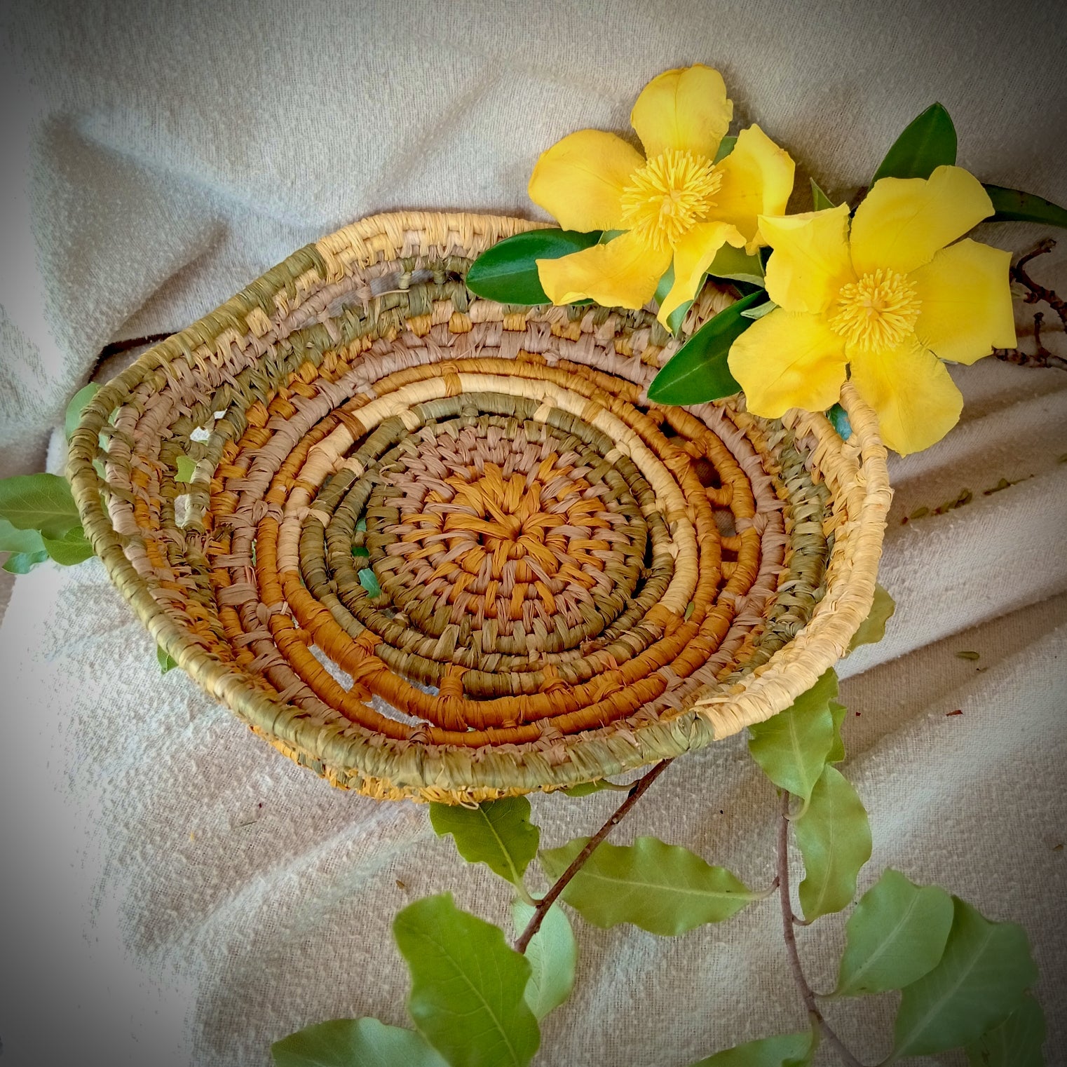 Small ornamental basket in saffron and green
