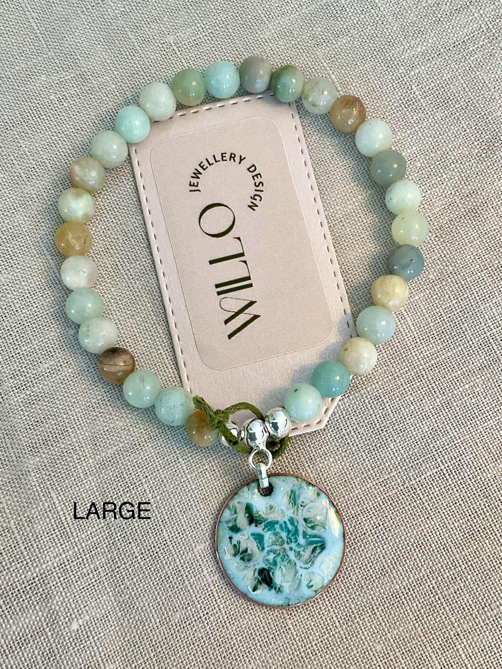 Amazonite gemstone bracelet with enamel charm.