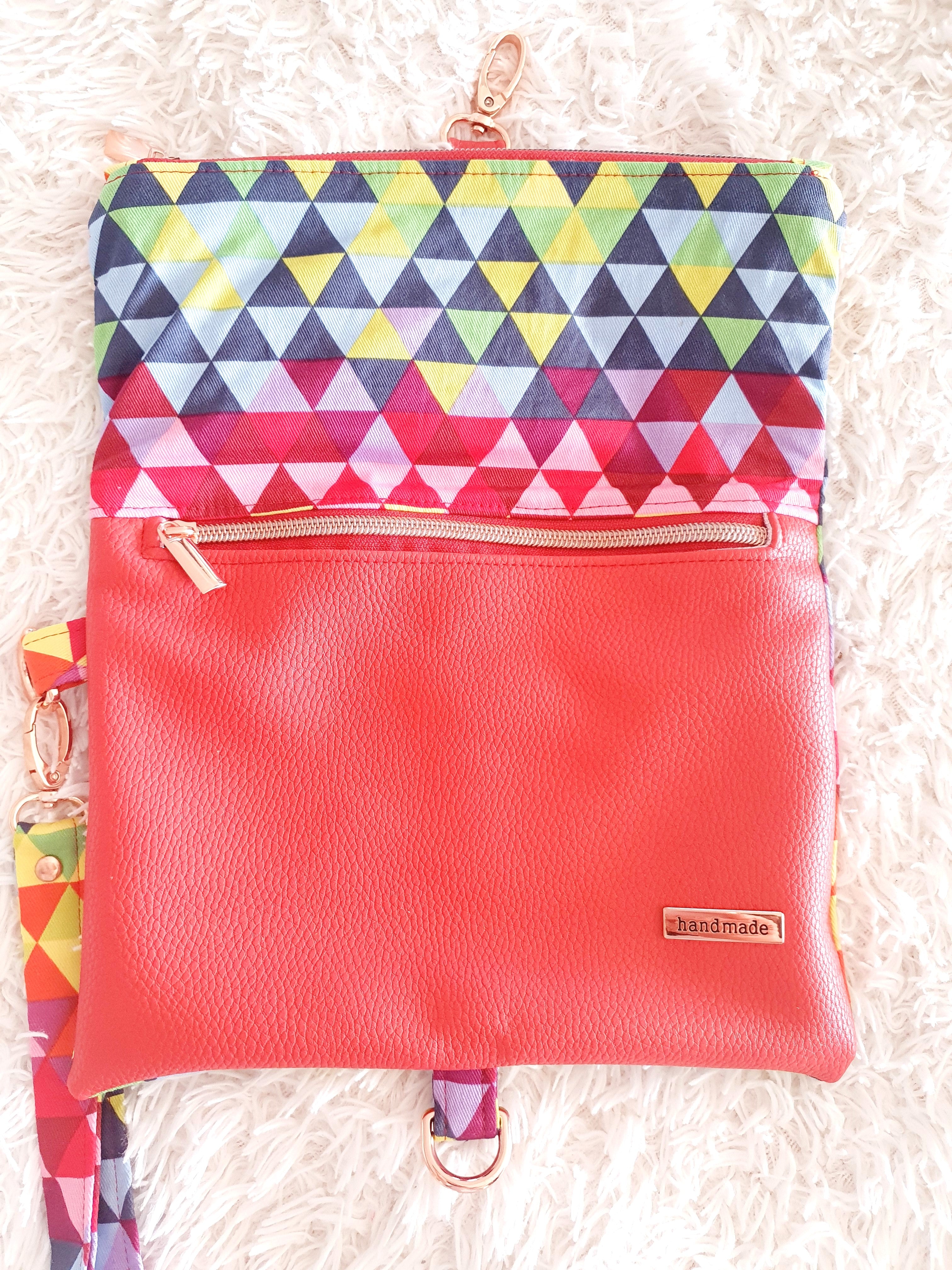 Multi colored red modern fold over zipper clutch with detachable strap