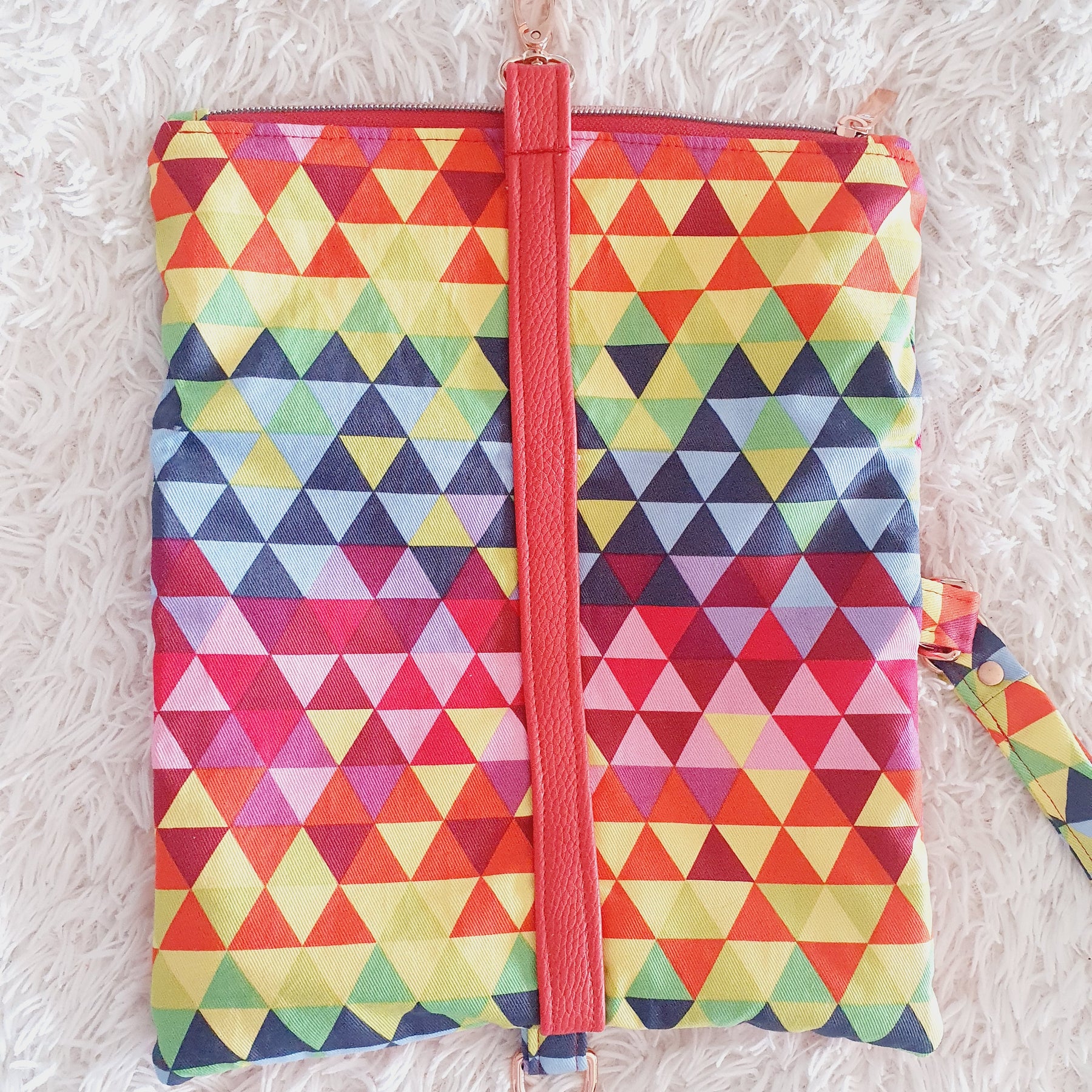 Multi colored red modern fold over zipper clutch with detachable strap