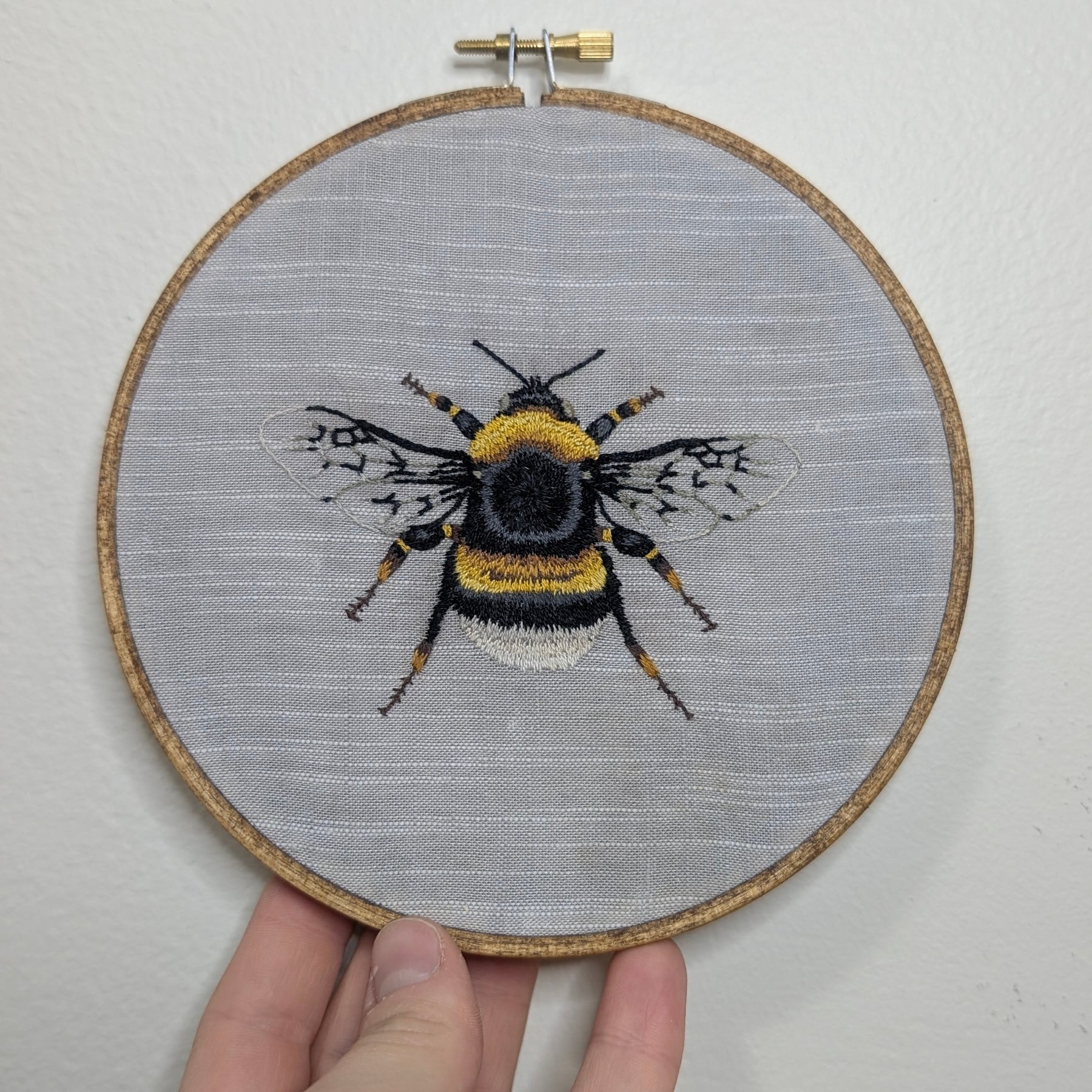 Bee embroidery framed in 6" wooden hoop