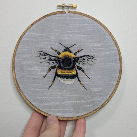 Bee embroidery framed in 6
