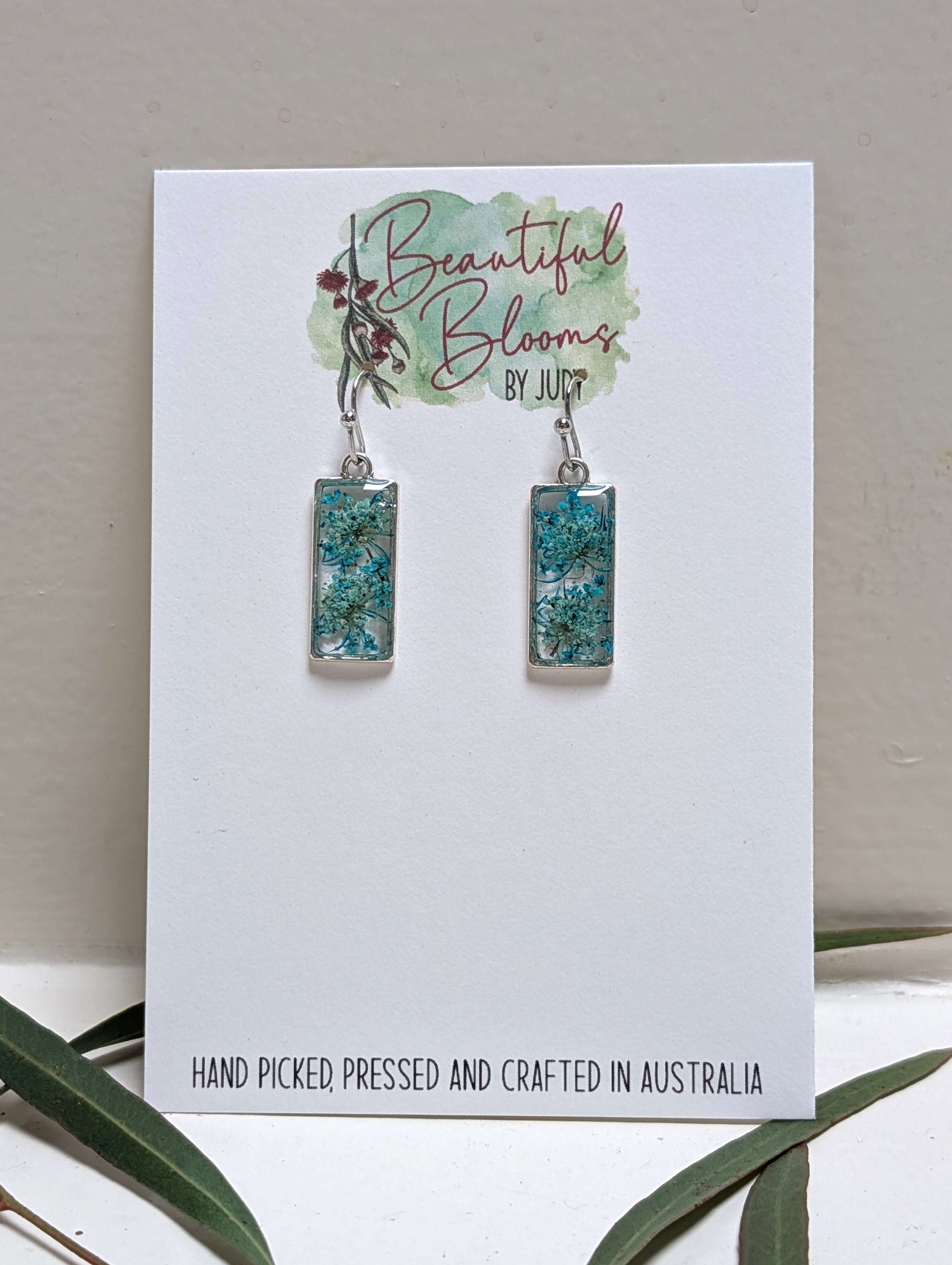 Rectangular silver earrings with teal Queen Anne's Lace