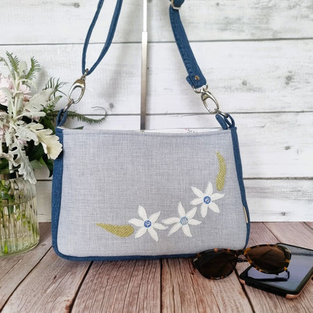 Handmade appliqued crossbody zip bag - blue with flannel flowers