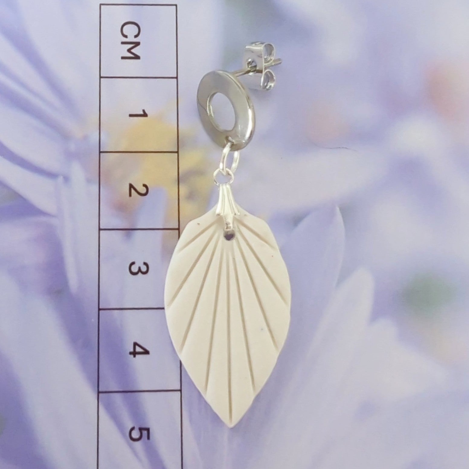 White Earrings with Silver in Different Designs.