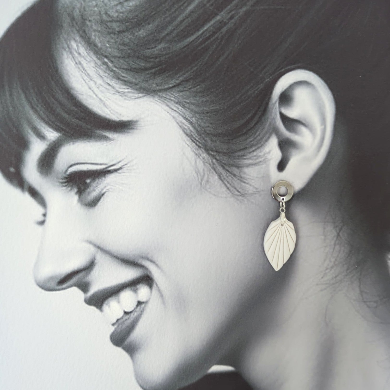 White Earrings with Silver in Different Designs.