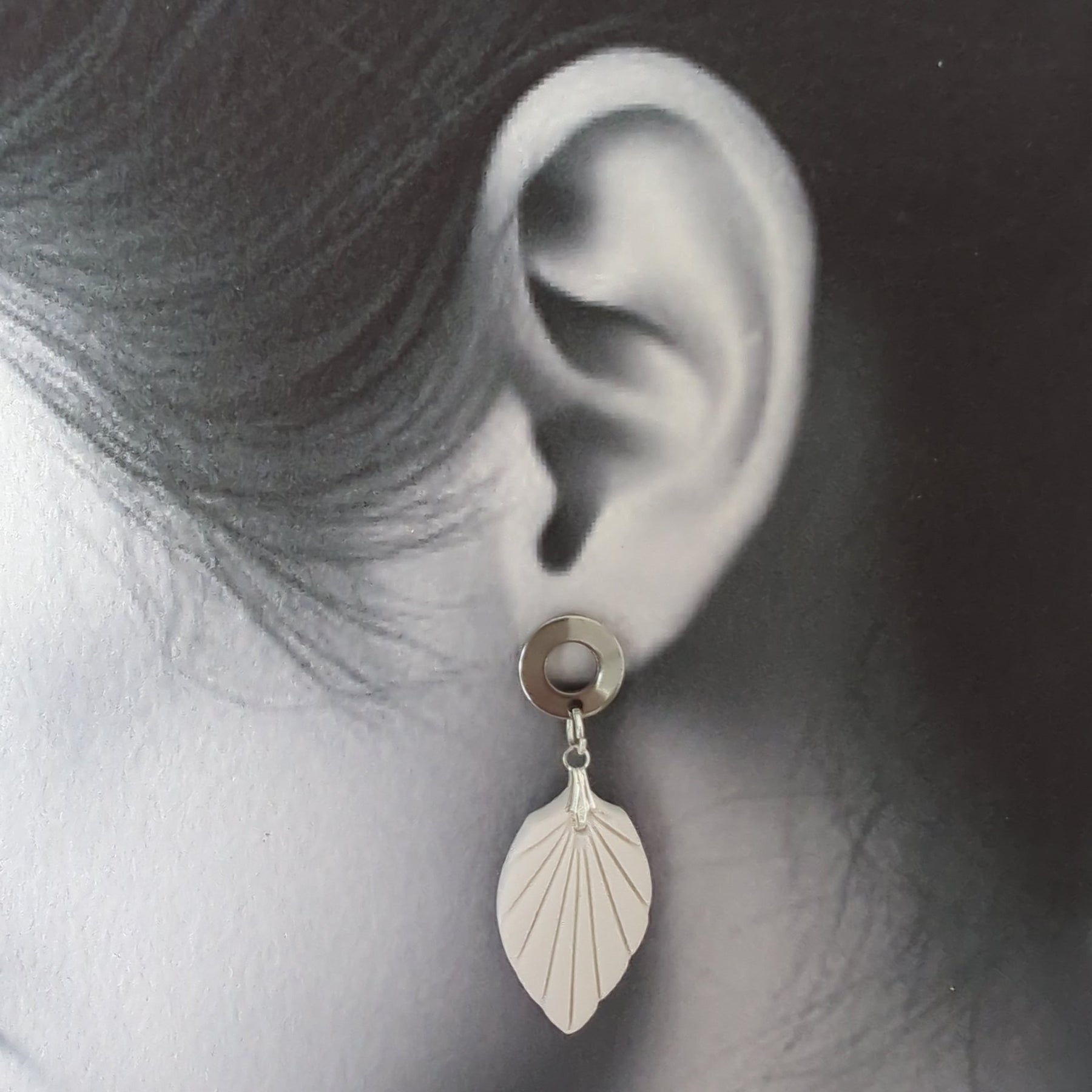 White Earrings with Silver in Different Designs.