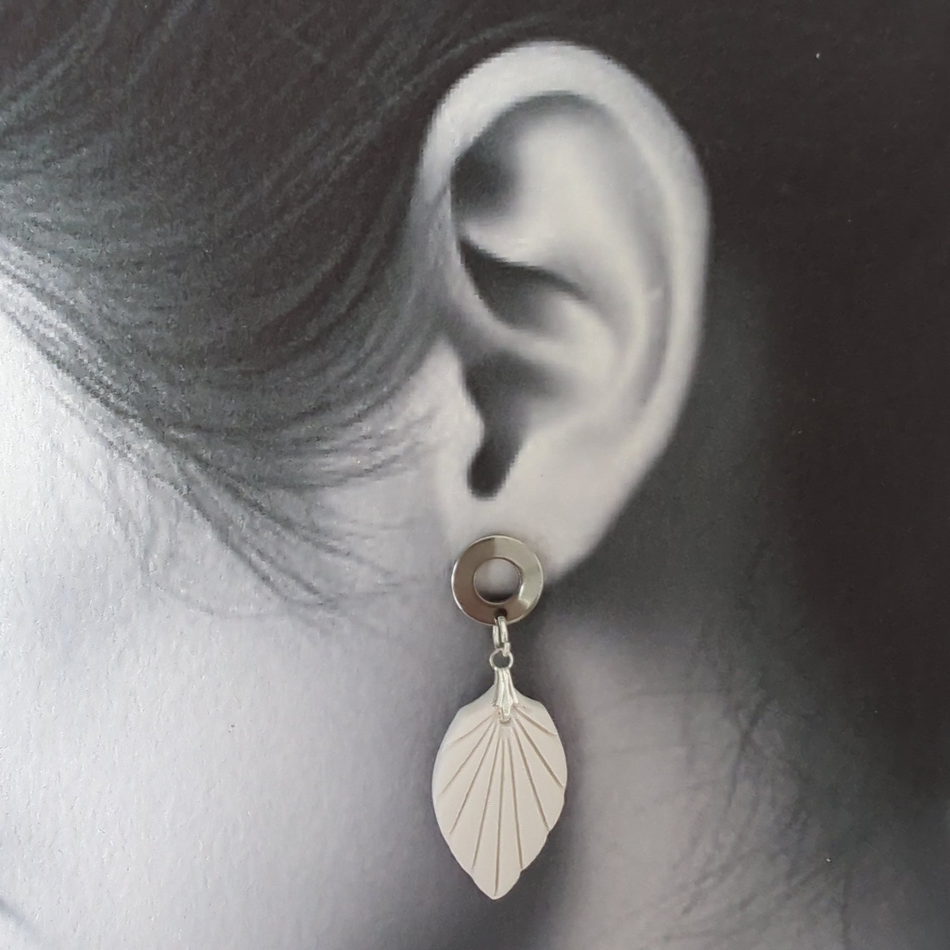 White Earrings with Silver in Different Designs.