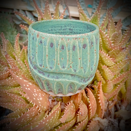 Rustic green and black coffee tumbler with rusty coloured flecks