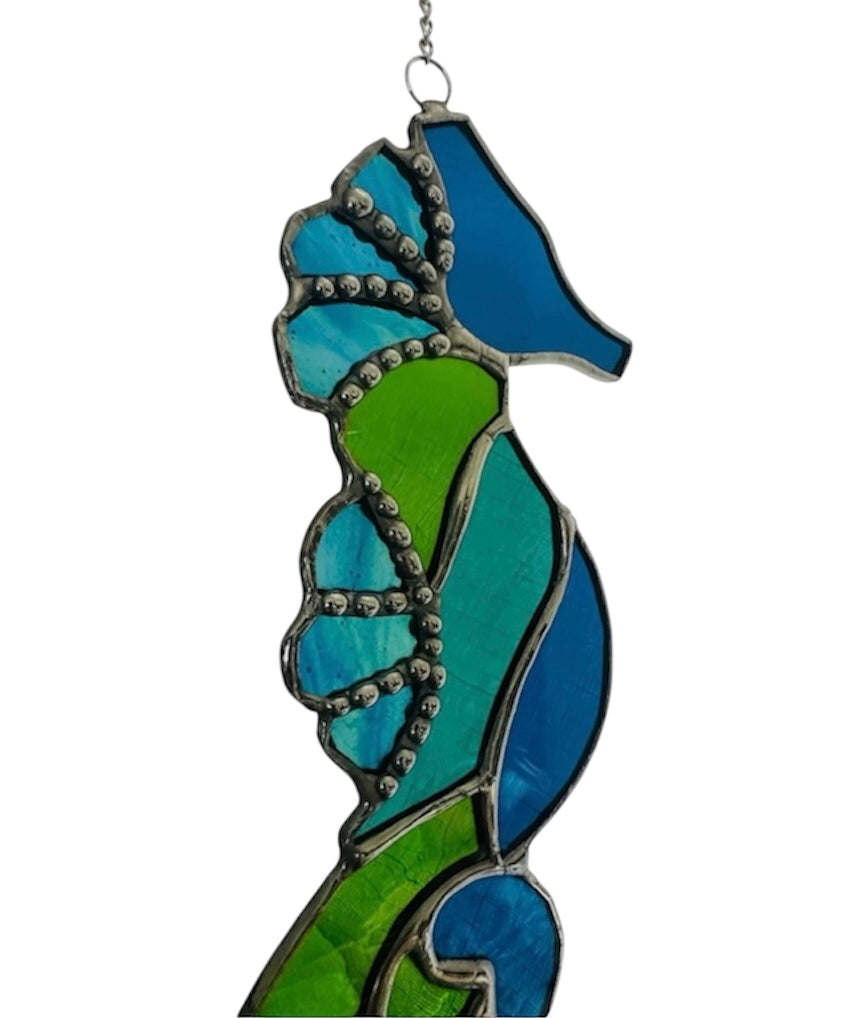 Stained glass seahorse in blue and green