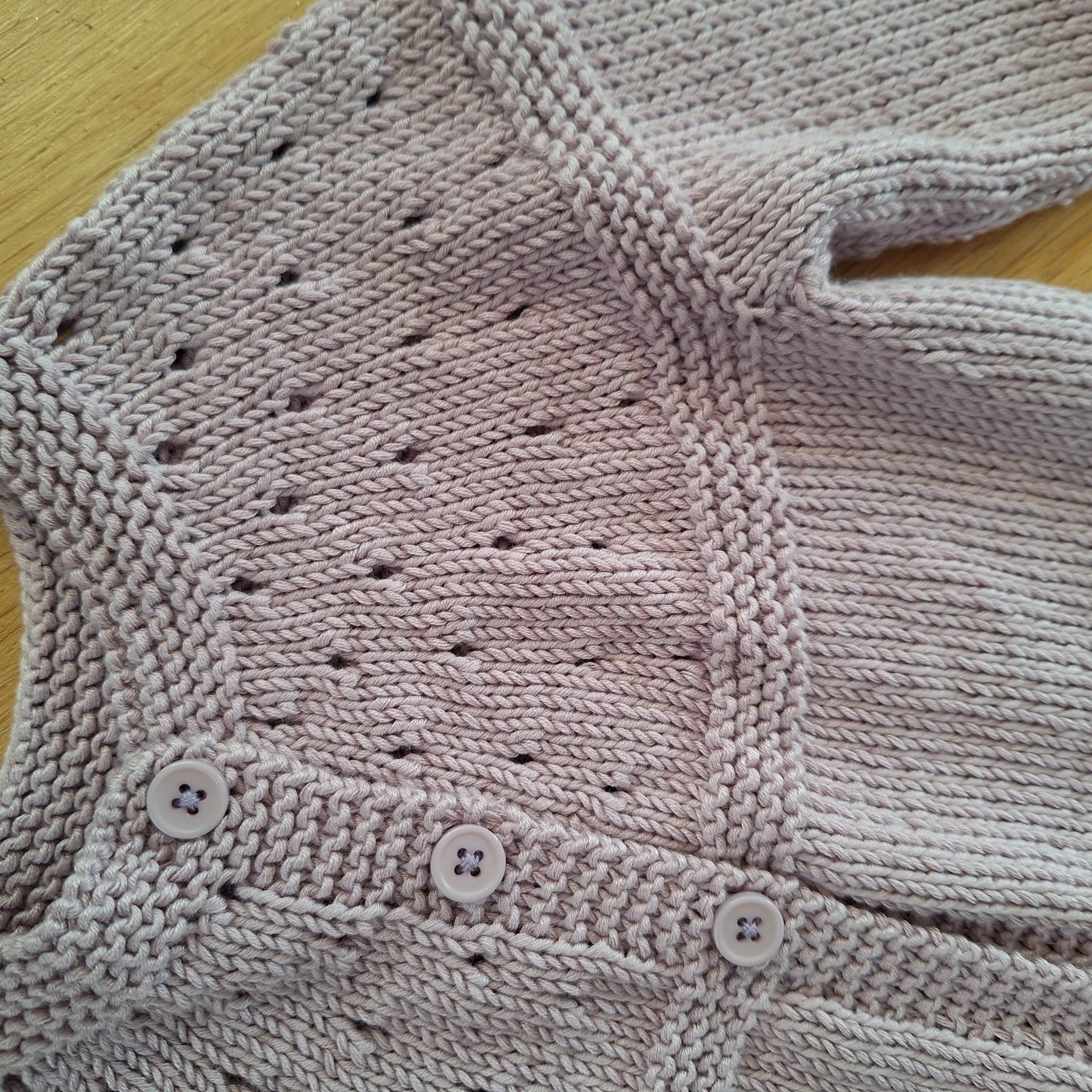 Handknitted Baby Cardigan in 100% natural Lilac yarn