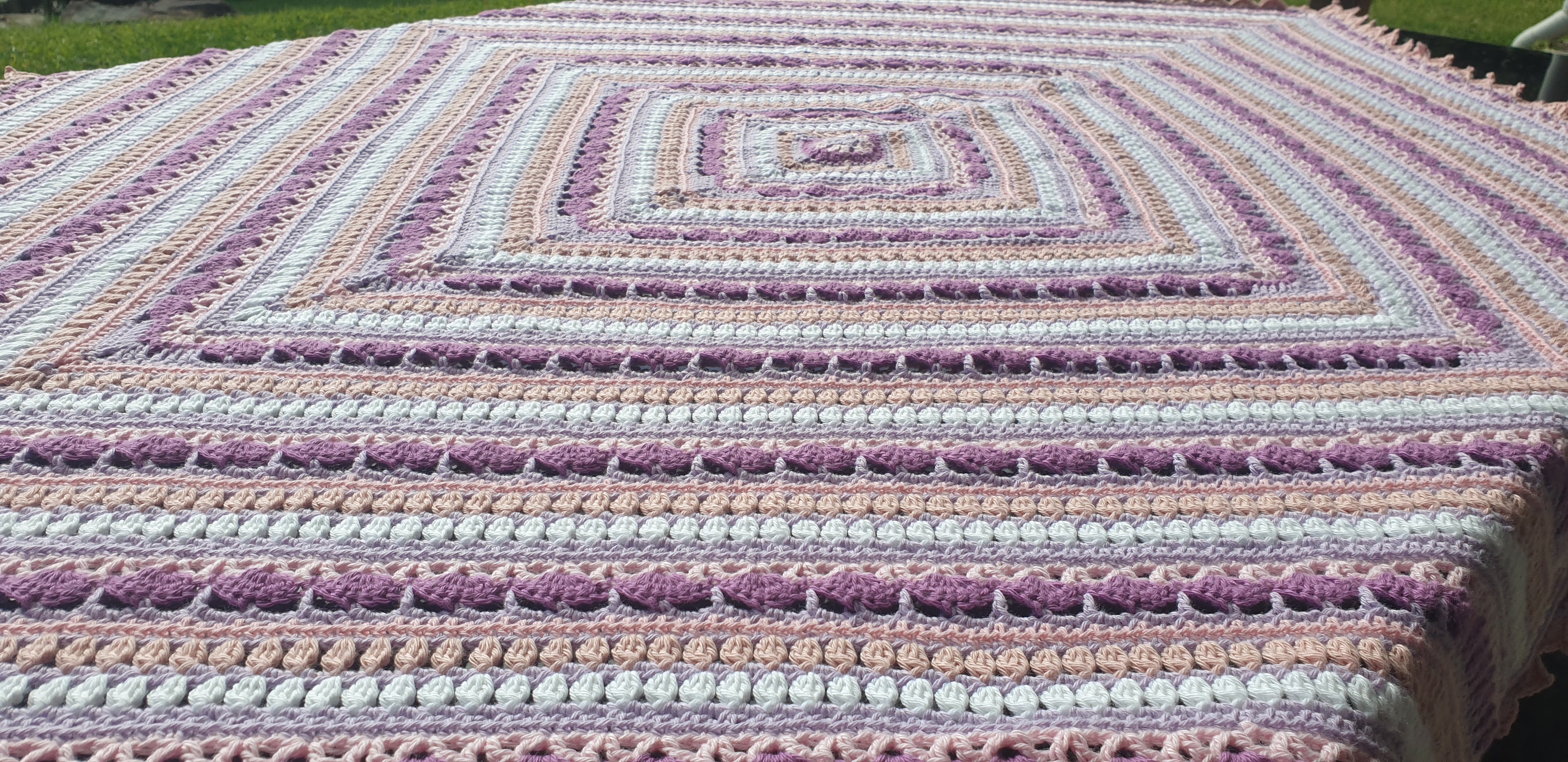 Beautiful crochet cotton afghan in pink/lilacs