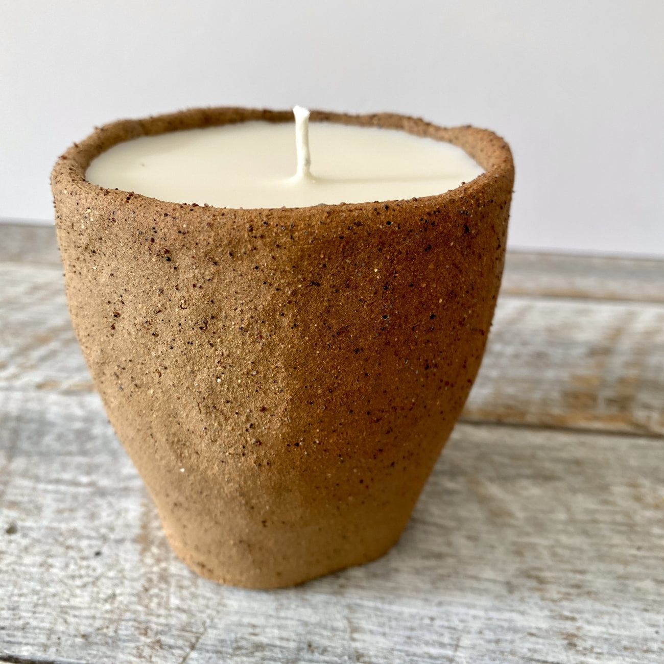 Hand poured soy candle in rustic handmade ceramic vessel