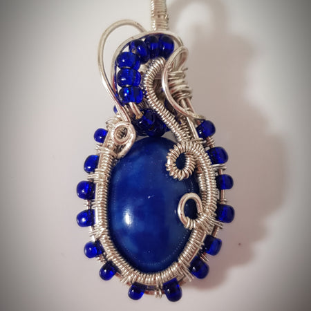 small Blue cabachon wire wrapped with silver wire