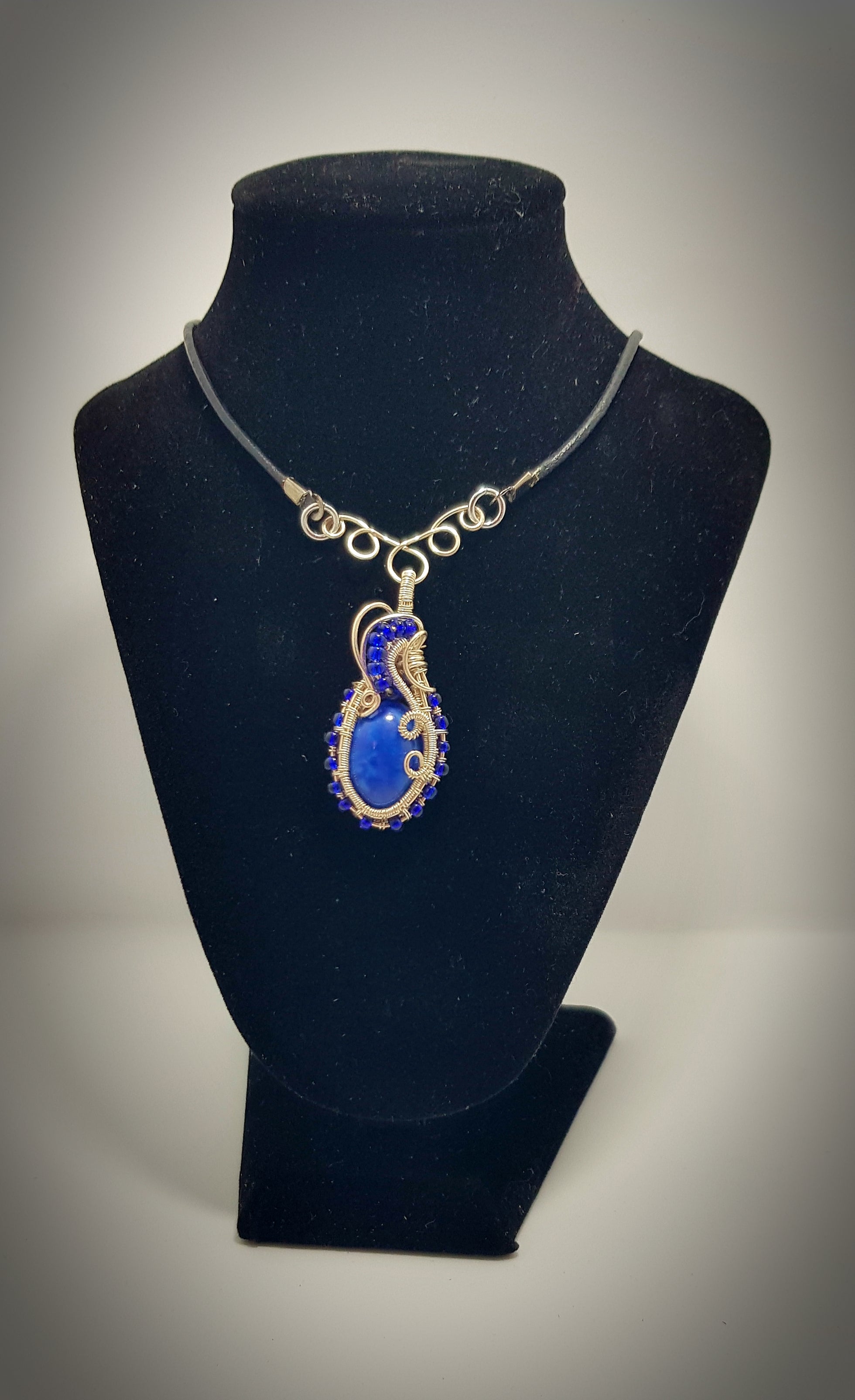 small Blue cabachon wire wrapped with silver wire