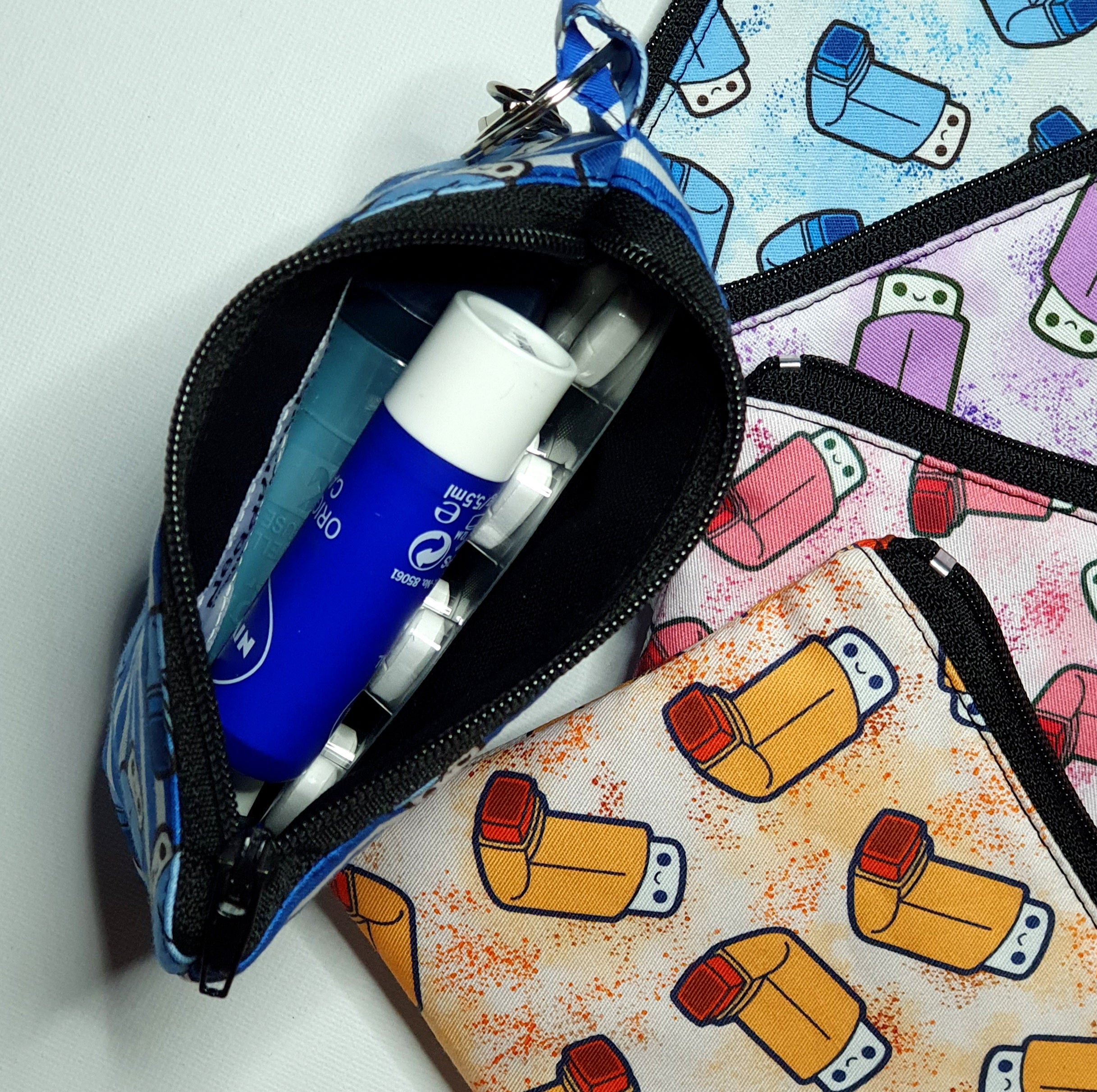 Clip-On Pouches in Various Asthma Puffer Fabrics